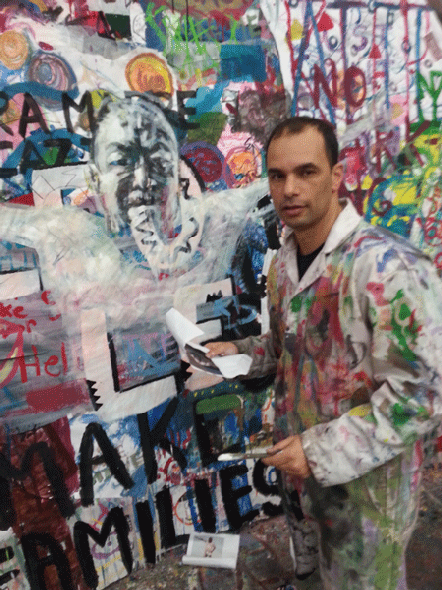 SERGE STROSBERG WITH HIS PAINTING OF AI WEIWEI (Photo: Gary Katz)